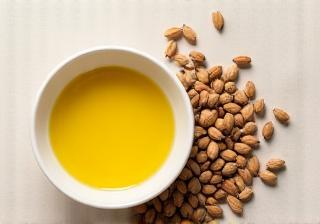 Jojoba seeds and oil in a dish
